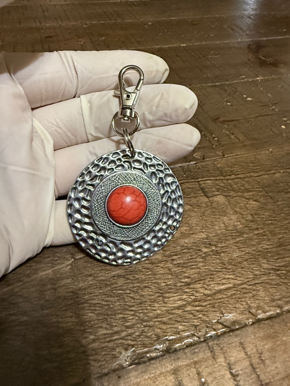 Silver Medallion Dangle keychain with Orange Center